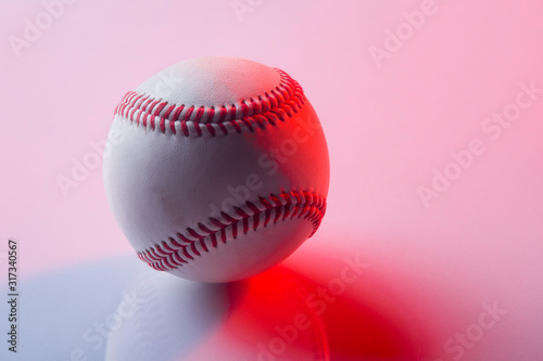Baseball ball isolated on pinkbackground. Red neon Banner Art concept