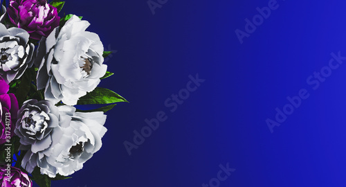 Blue floral background with white and purple peonies on side. Women's Day background, Floral background concept. Spring time concept. Invitation, greeting card. Mockup. 3d rendering