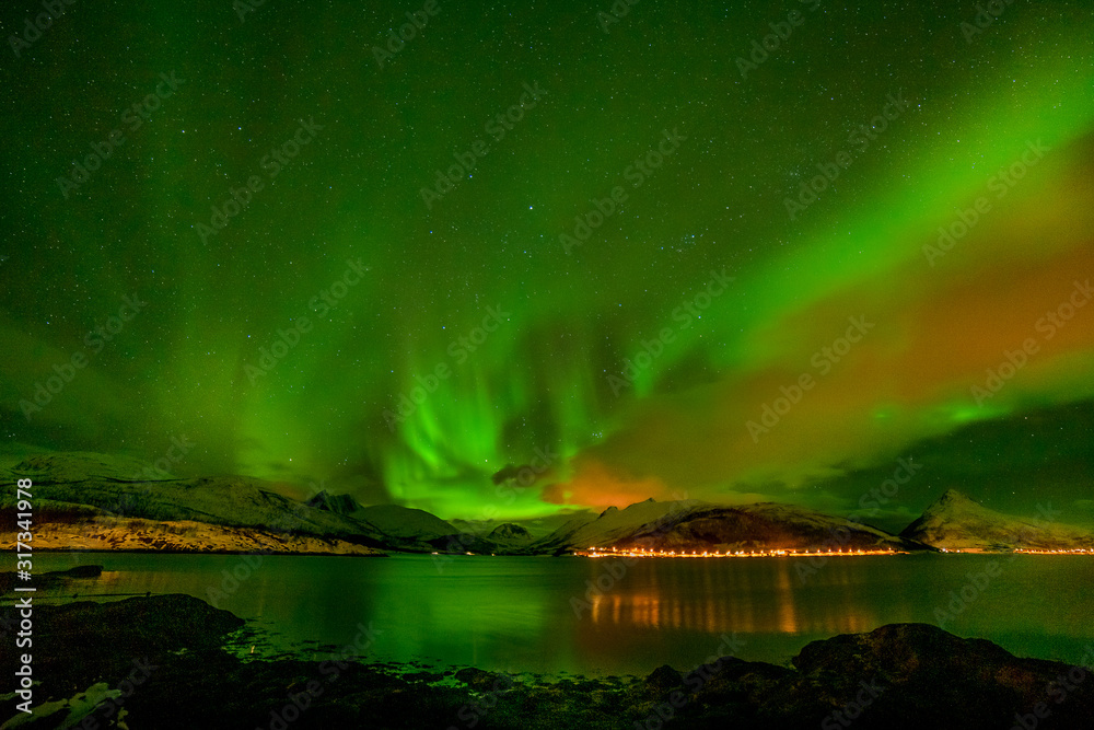 beautiful aurora borealis, polar lights, over mountains in the North of Europe - Lofoten islands, Norway