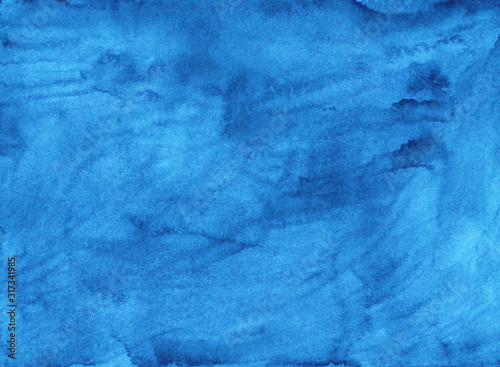 Watercolor liquid blue background texture. Hand painted watercolour backdrop. Sky blue stains on paper.
