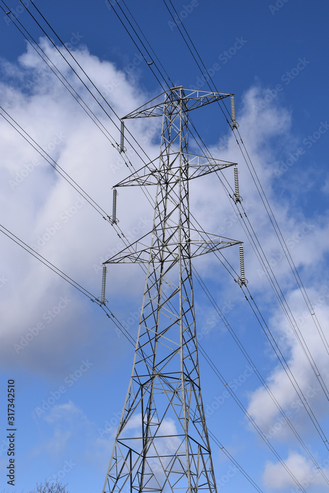 Power Transmission Pylon & Wires against Blue Sky Power Transmission Pylon & Wires against Blue Sky