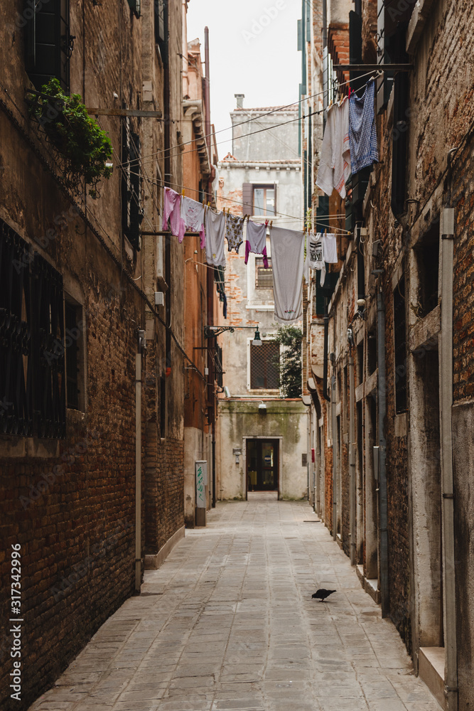 Lonely street of the city of Venice, Italy. Clothes hanging