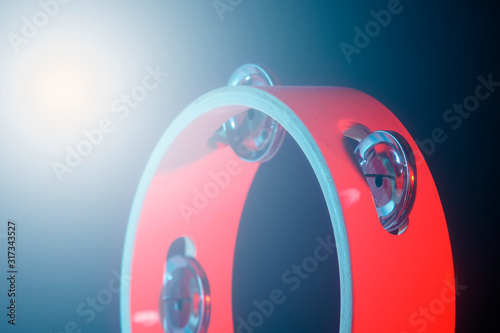 Tambourine isolated on black background. Single classical music instrument. photo