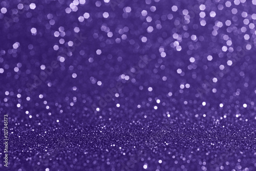 Abstract blurred background.Sparkling bokeh.Glitter texture.Outstanding ultra violet color.
