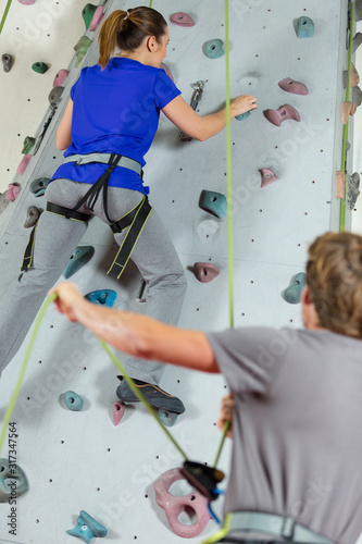 young woman in a free climbing wall