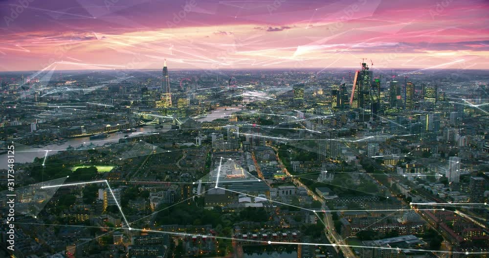 Aerial view of London Skyline with connections. Technology-Futuristic. High tech view of the financial district connected through a network. Internet of Things. Artificial intelligence. RED 8K.