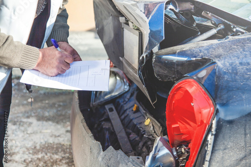 man hand document with car insurance