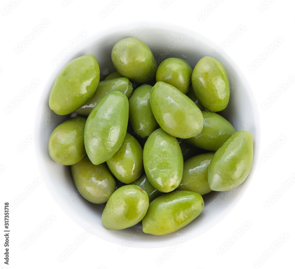 Large olives with cuttings in a porcelain bowl. Top view close up. Large olives with cuttings in a porcelain bowl. Top view close up.