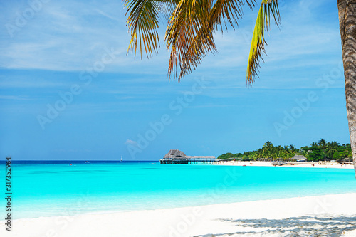Panoramic view of a beautiful sunny day on sandy beach on exotic island.