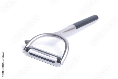Vegetable peeler metal isolated in different poses on white background