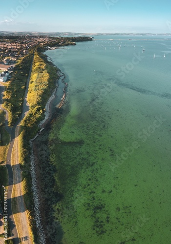 Vertical aerial shot of the coast at Rodwell Trail, Wyke, Weymouth, Dorset, UK photo