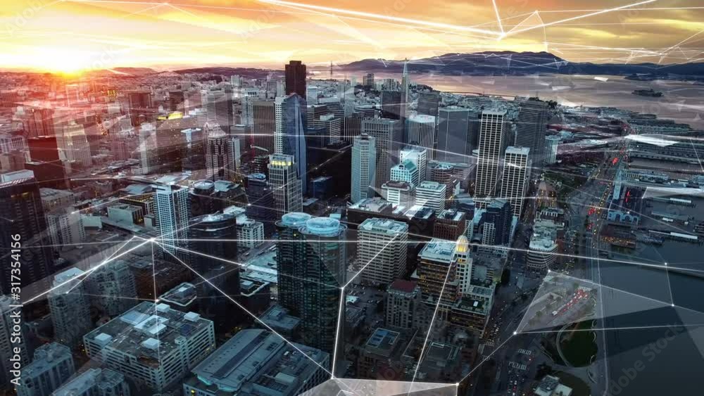 Futuristic aerial view of San Francisco financial district during sunset. Connected city. Technology network concept. California, United States. Shot from a helicopter.  