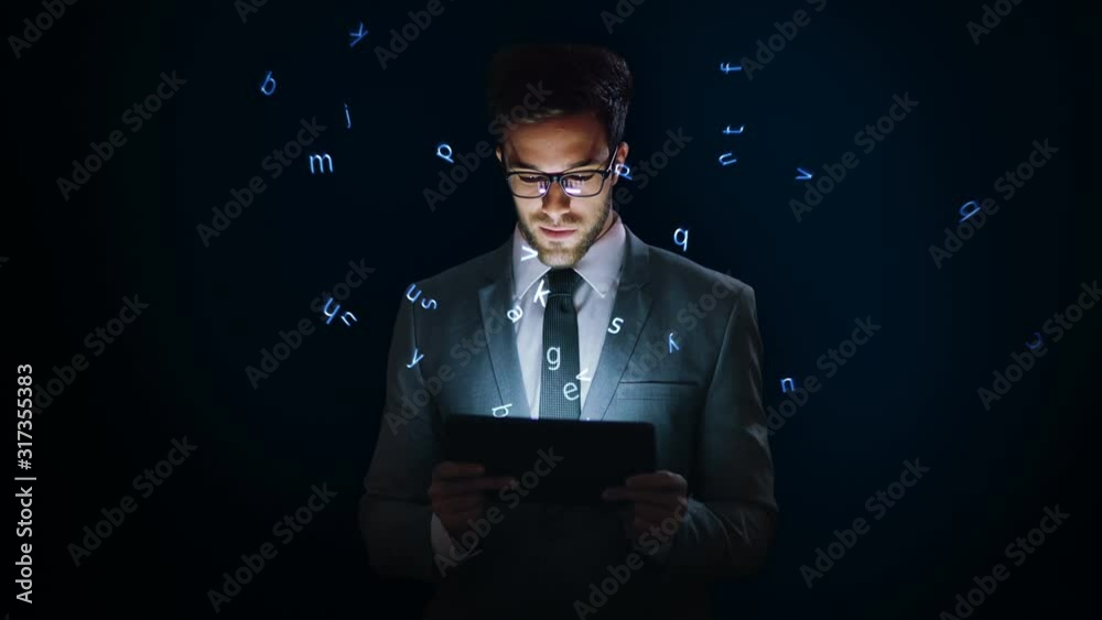 Businessman using a tablet with holographic letters. VR. Futuristic technology. Augmented reality. Blue. 