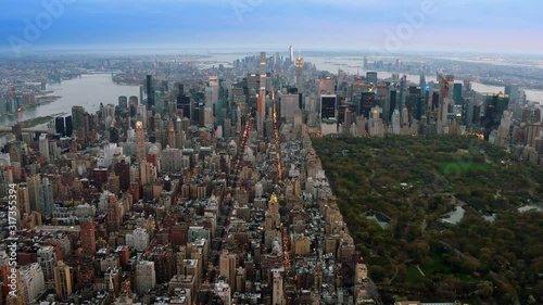 Beautiful aerial view of Central Park in Midtown Manhattan. Iconic skyscrapers as the Freedom Tower and the Empire State Building. New York City, United States. Shot from a helicopter. 