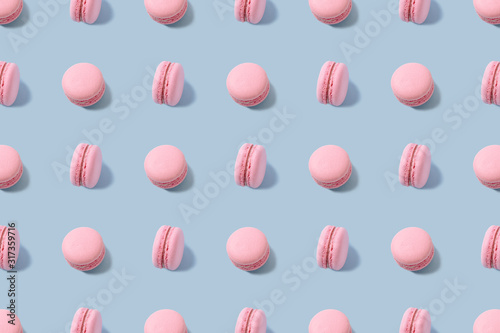 Sweet colorful macarons isolated on blue
