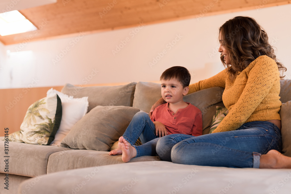 Mother and son relaxing in the living room Mother and son relaxing in the living room
