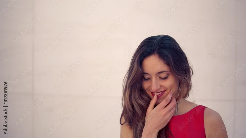 Beautiful woman in red elegant dress. Urban white background. Beautiful woman in red elegant dress. Urban white background.