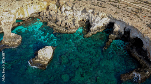 aerial photography from a drone from a height to the shore with the sea and mountains on Ayia Napa island cyprus