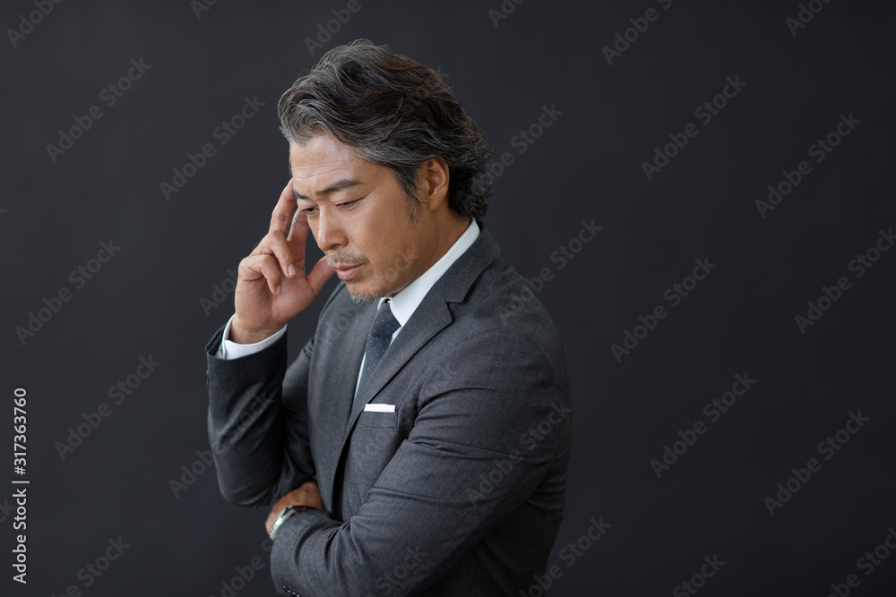 Successful businessman thinking