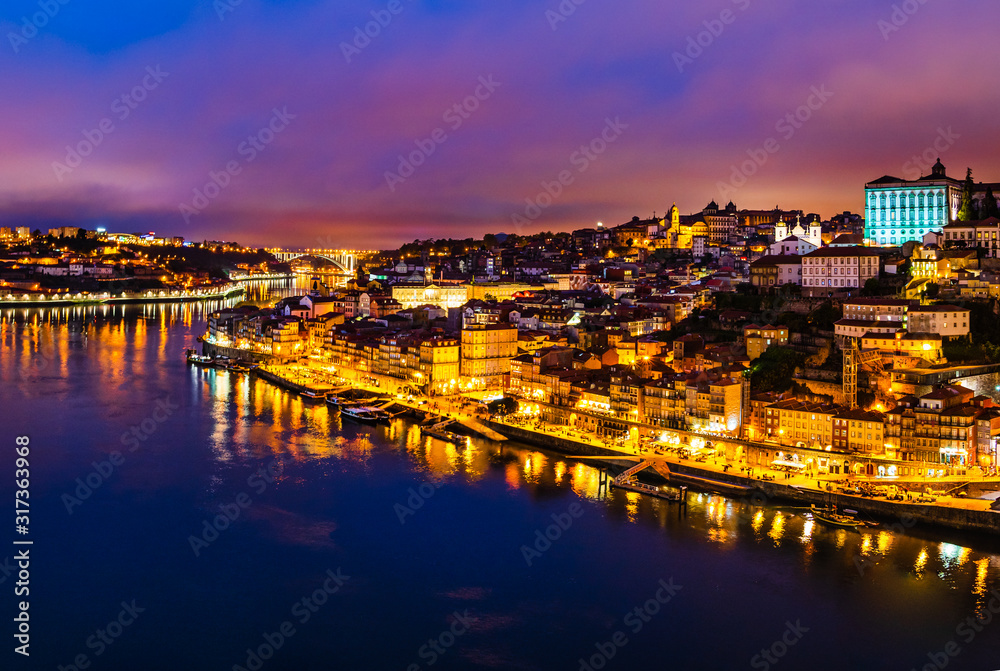 Porto city skyline, night cityscape panorama from Luis I bridge of Porto, Portugal