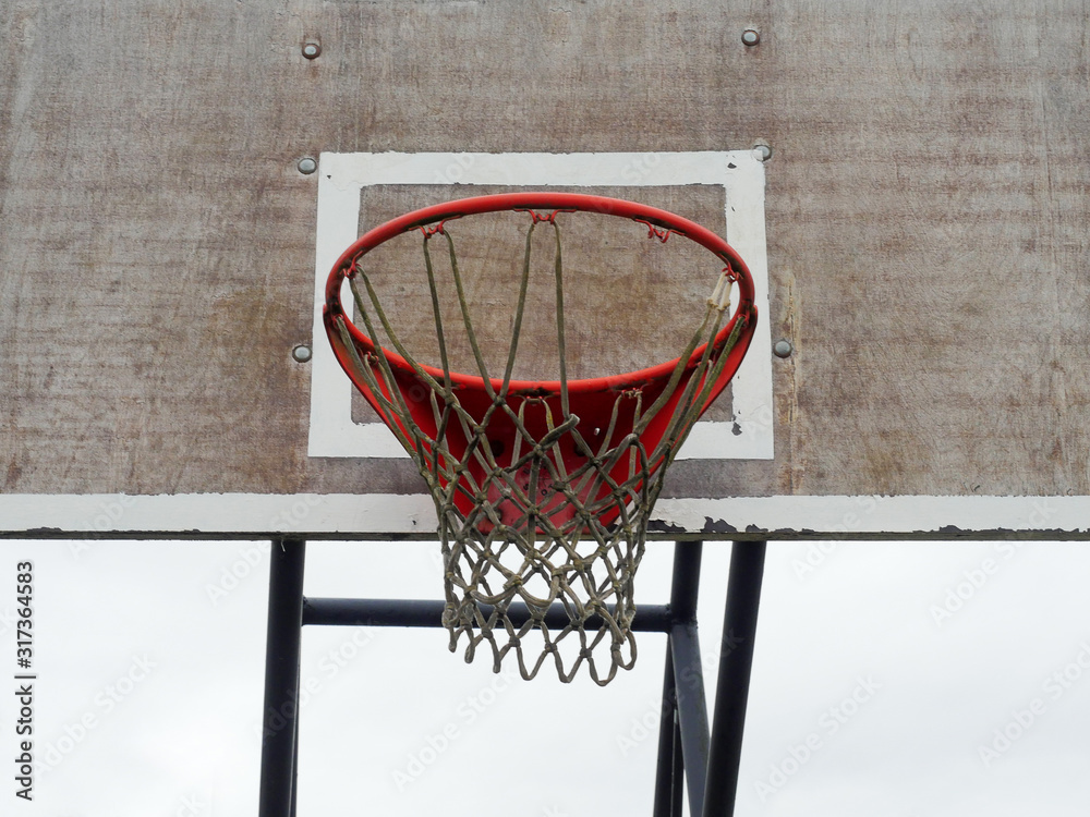 Basketball red hoop and net on a wooden old worn board, Basketball red hoop and net on a wooden old worn board,