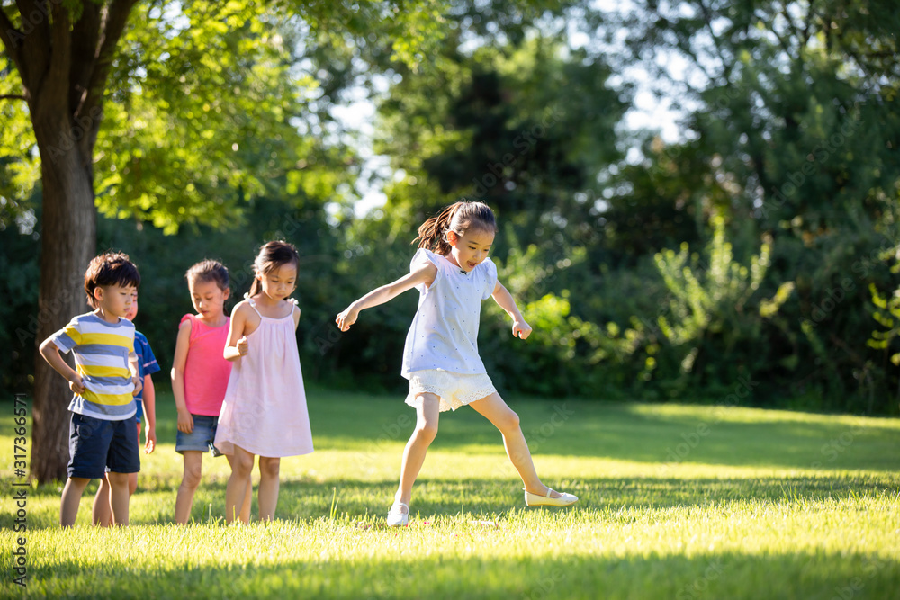 Happy children playing on meadow Happy children playing on meadow