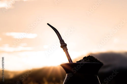 Chimarrão, or mate, is a characteristic drink of the culture of southern South America bequeathed by indigenous cultures. It consists of a gourd, a pump, ground yerba mate and warm water. photo