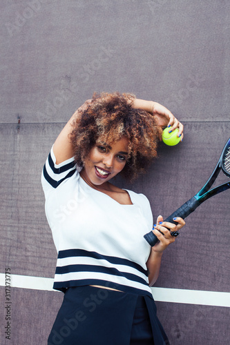 young stylish afro-american girl playing tennis, sport healthy lifestyle people concept © iordani