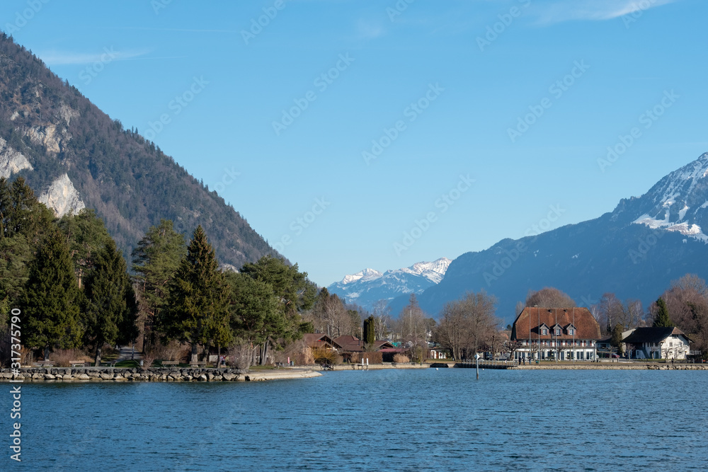 View of Lake Thun near the town of Spietz, Interlaken, Switzerland, photographed on a clear day whilst on a boat tour of the lake in mid winter.