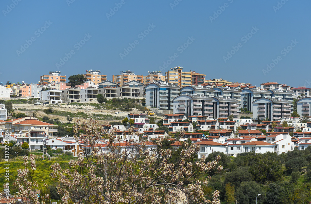 Waterfront and Kusadasi cityscape in sunny summer day.