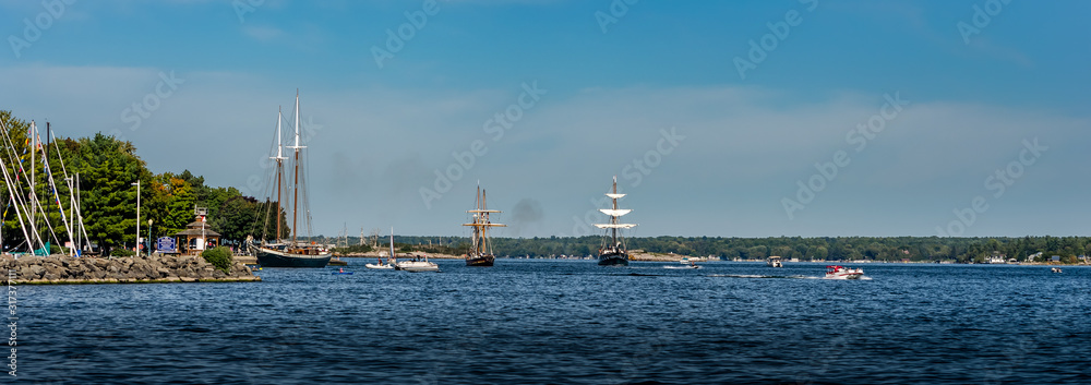 Panorama of three Tall Ships sailing along the Brockville coastline