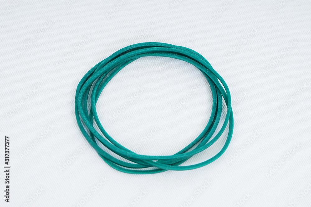 Green elastic bands on a white background Green elastic bands on a white background