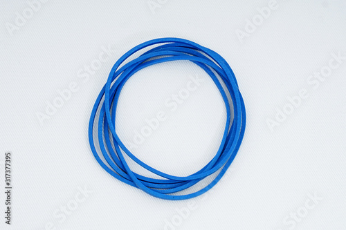Blue elastic bands on a white background © fuad