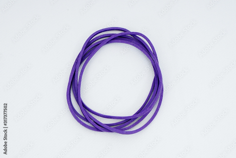 Purple elastic bands on a white background Purple elastic bands on a white background