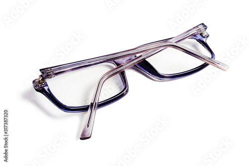 Old horn-rimmed glasses on a white background isolated.