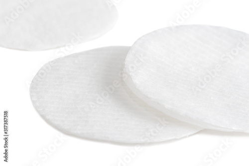 Hygienic cotton pads for wiping and facial skin care on a white background.