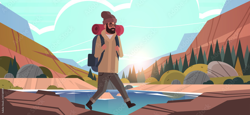 man traveler hiking with backpack travel lifestyle wanderlust adventure ...