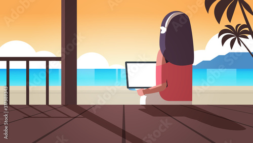 woman using laptop on tropical sea beach summer vacation online communication blogging concept rear view blogger sitting on wooden terrace seascape background horizontal vector illustration