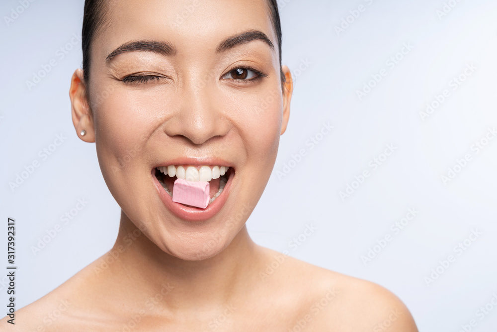 Smiling Asian woman posing for camera in studio Smiling Asian woman posing for camera in studio