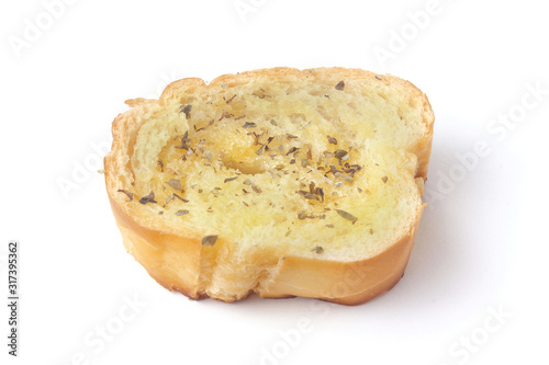 sliced homemade toasted herb bread isolated white background