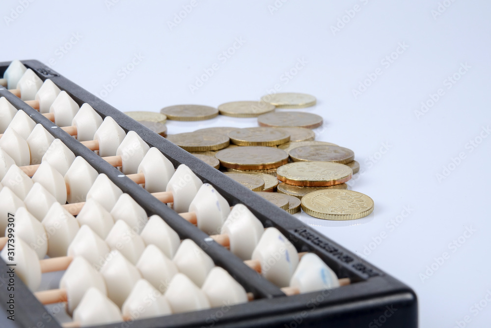 Abacus and coins. Business concept Abacus and coins. Business concept