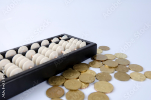 Abacus and coins. Business concept