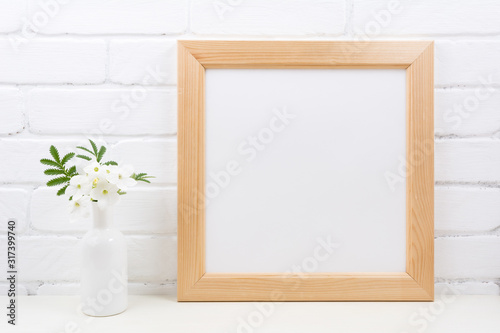 Wooden square frame mockup with Tobacco flowers © TasiPas