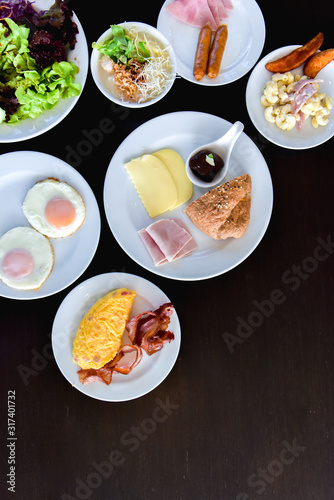 Breakfast table with waffles cheese eag and salad, Delicious breakfast on a light table, Top view breakfast on the table with copy space