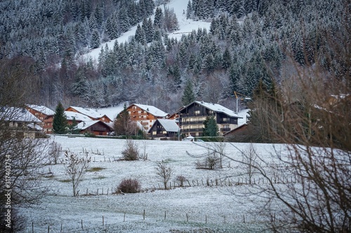 The beautiful mountain cottages in Thollon Les Memises, France in Winter photo