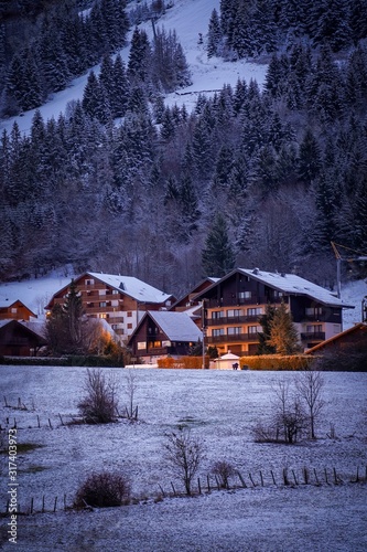 The beautiful mountain cottages in Thollon Les Memises, France in Winter photo