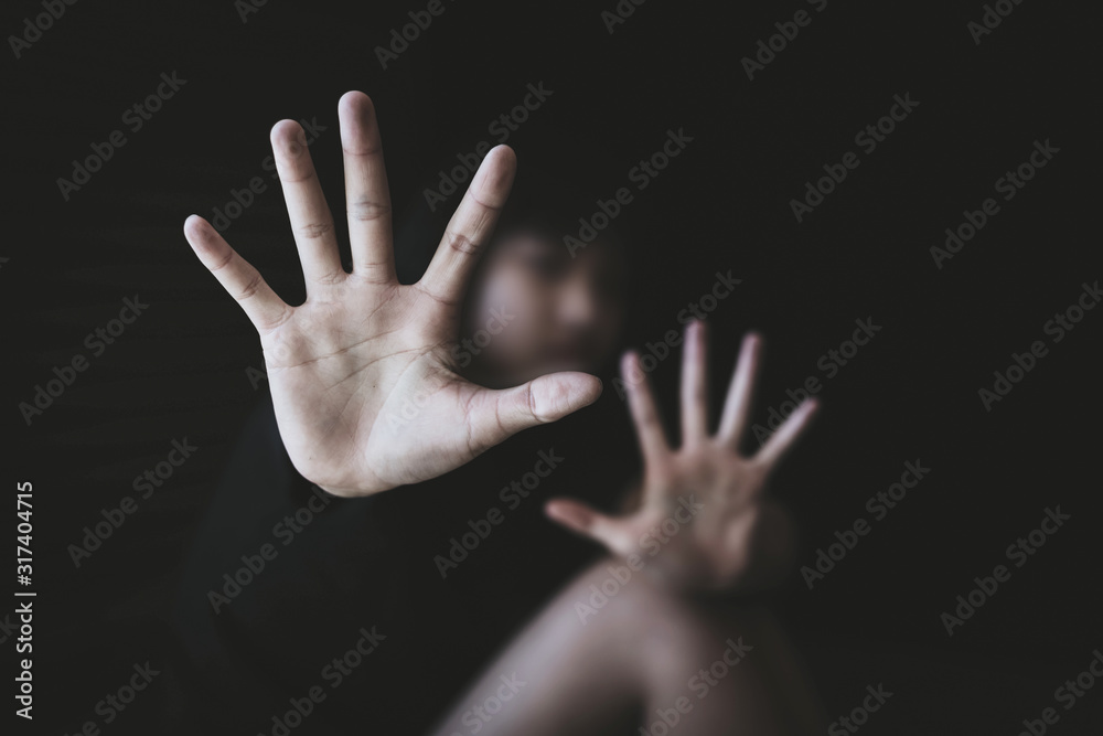 Young girl sitting on the floor with showing stop hand for stop violence and rape, Young girl sitting on the floor with showing stop hand for stop violence and rape,