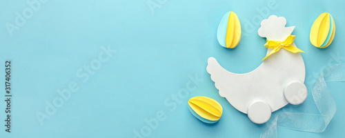Quadro su tela Easter holiday creative background with papercraft eggs, white wooden chicken hu