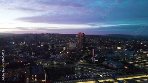 Wallpaper Mural Sheffield City Centre drone shot over the sky line sheffield hallam bramall lane tall sky scraper aerial shot during sunset night shot sun down blue orange purple sky UK city Torontodigital.ca