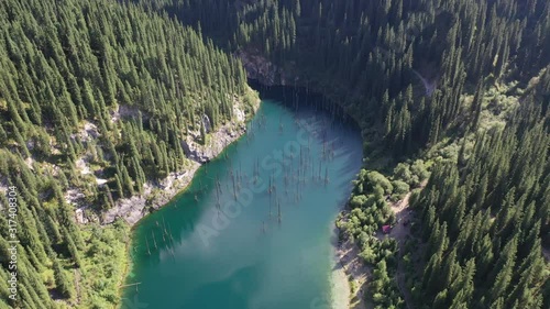 Kaindy lake and fir trees in the Kungei-Alatau mountains. The Northern Tien Shan. Kazakhstan. photo